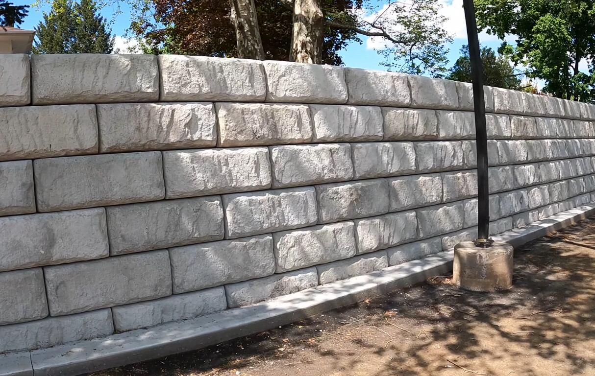 Finished decorative concrete retaining wall with stone pattern in Chicopee, MA